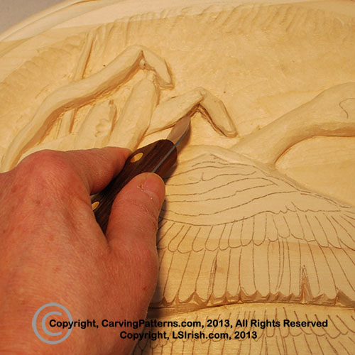 Learn how to wood burn your carvings to clean up rough carving areas 