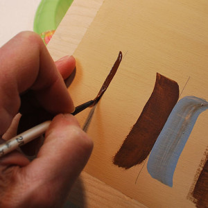 How to paint detail lines on your relief carvings, free project by Lora Irish