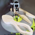 scroll saw cutting a wood carving spoon blank